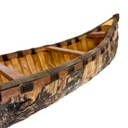 Zeckos Decorative Canoe Statue, 31 Inch Brown Freestanding Rustic Tabletop Sculpture with Natural Finish, Bark-Like Exterior
