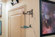 Rustic Brown and Sea Green Cast Iron Swimming Mermaid Hanging Wall Sculpture, 14.25 Inches High, Adorned with a Rustic Scroll