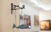 Rustic Brown and Sea Green Cast Iron Swimming Mermaid Hanging Wall Sculpture, 14.25 Inches High, Adorned with a Rustic Scroll