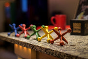 Vibrant Set of 5 Cast Iron Toy Jack Decorative Sculptures - Nostalgic Red, Orange, Green, Blue, and Yellow Accents - 4.75