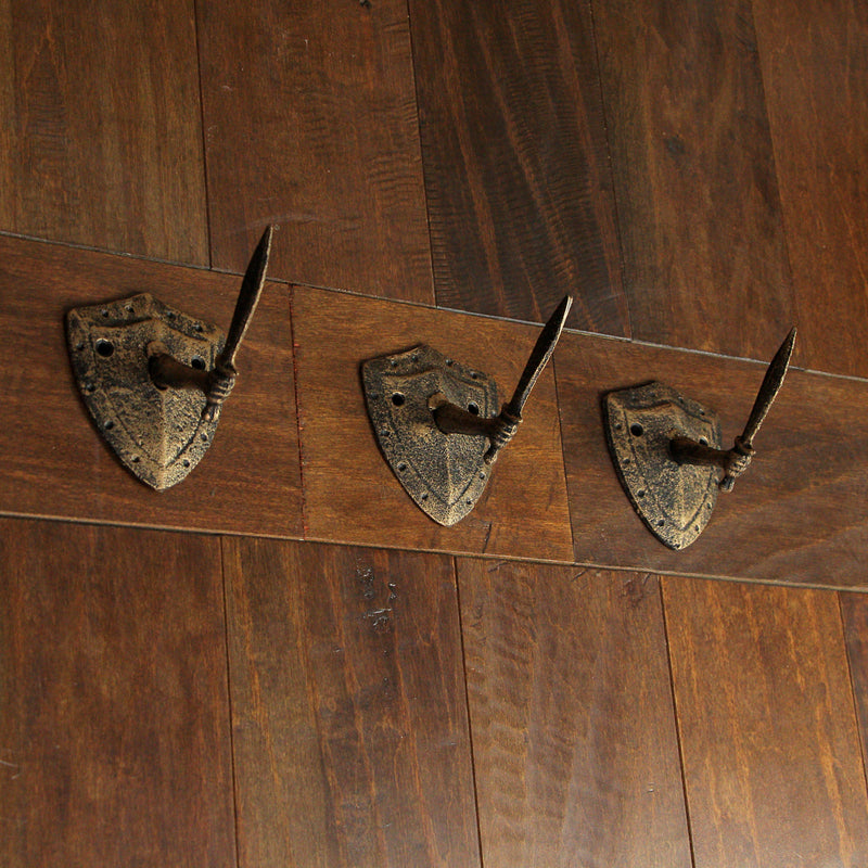 Zeckos Cast Iron Fun Wall Hooks - Set of 3, Bronze Sword & Shield Decorative Hooks for Entryway Wall, Perfect for Swordsman,