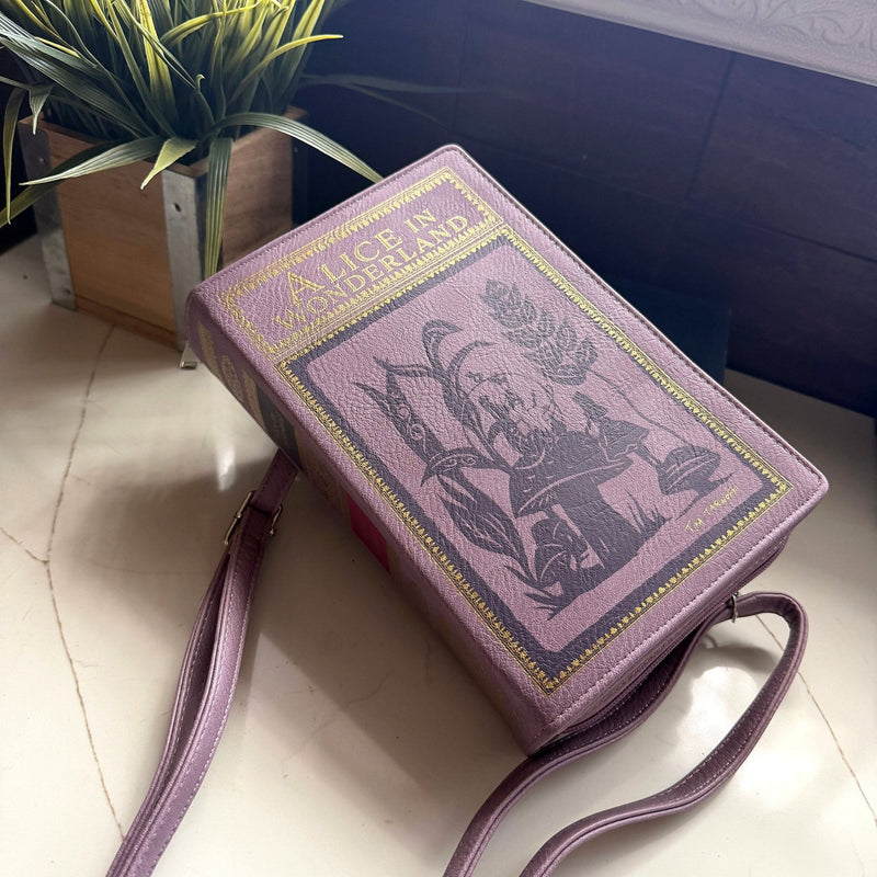 Things2die4 Book-Shaped Crossbody Bag, Alice in Wonderland Lavender Vinyl Handbag with Detachable Shoulder and Wrist Straps,