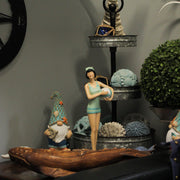Graceful Brunette Retro Bathing Beauty Figurine – Sage Green & Light Blue Striped Swimsuit, Holding Beach Ball, Hand-Painted
