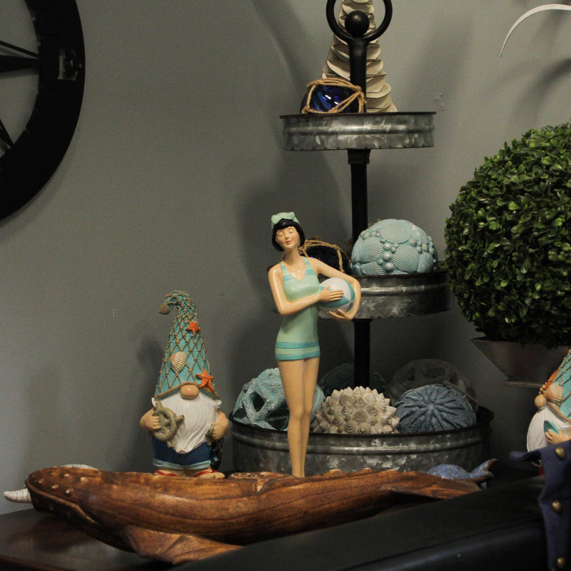 Graceful Brunette Retro Bathing Beauty Figurine – Sage Green & Light Blue Striped Swimsuit, Holding Beach Ball, Hand-Painted
