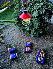 Rustic Metal Red, White, and Blue Patriotic LED Hanging Solar Lantern With Cutout Stars for Beautiful Indoor and Outdoor